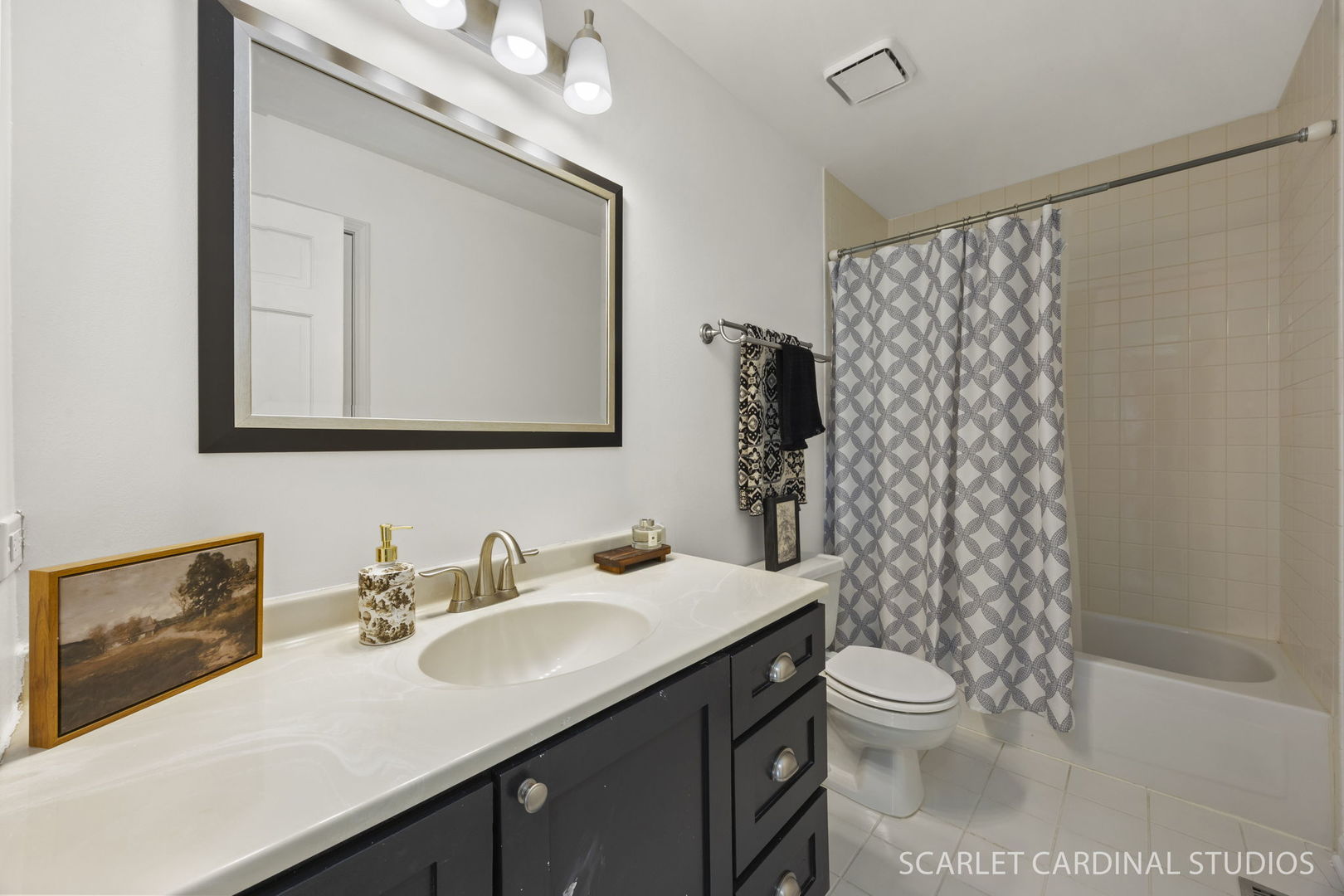 528 Pershing Avenue, Unit G Glen Ellyn, IL 60137 - Photo 11 of 14 a bathroom with a sink a toilet a mirror a vanity and shower