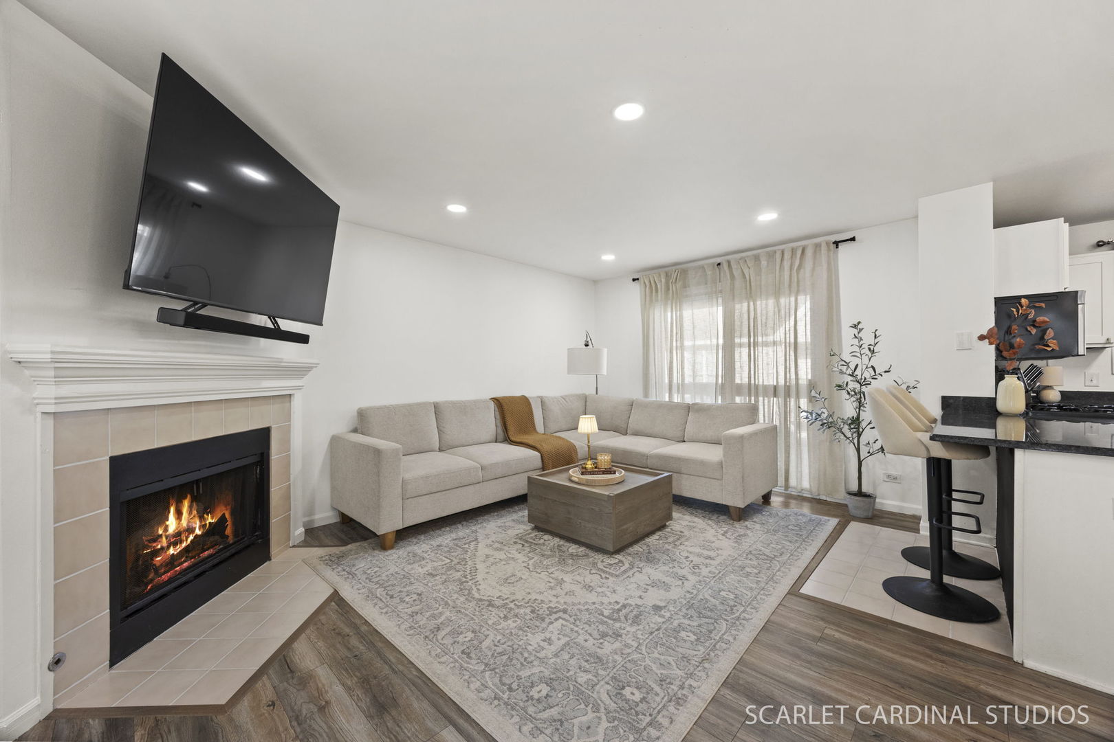 528 Pershing Avenue, Unit G Glen Ellyn, IL 60137 - Photo 3 of 14 a living room with furniture a fireplace and a flat screen tv