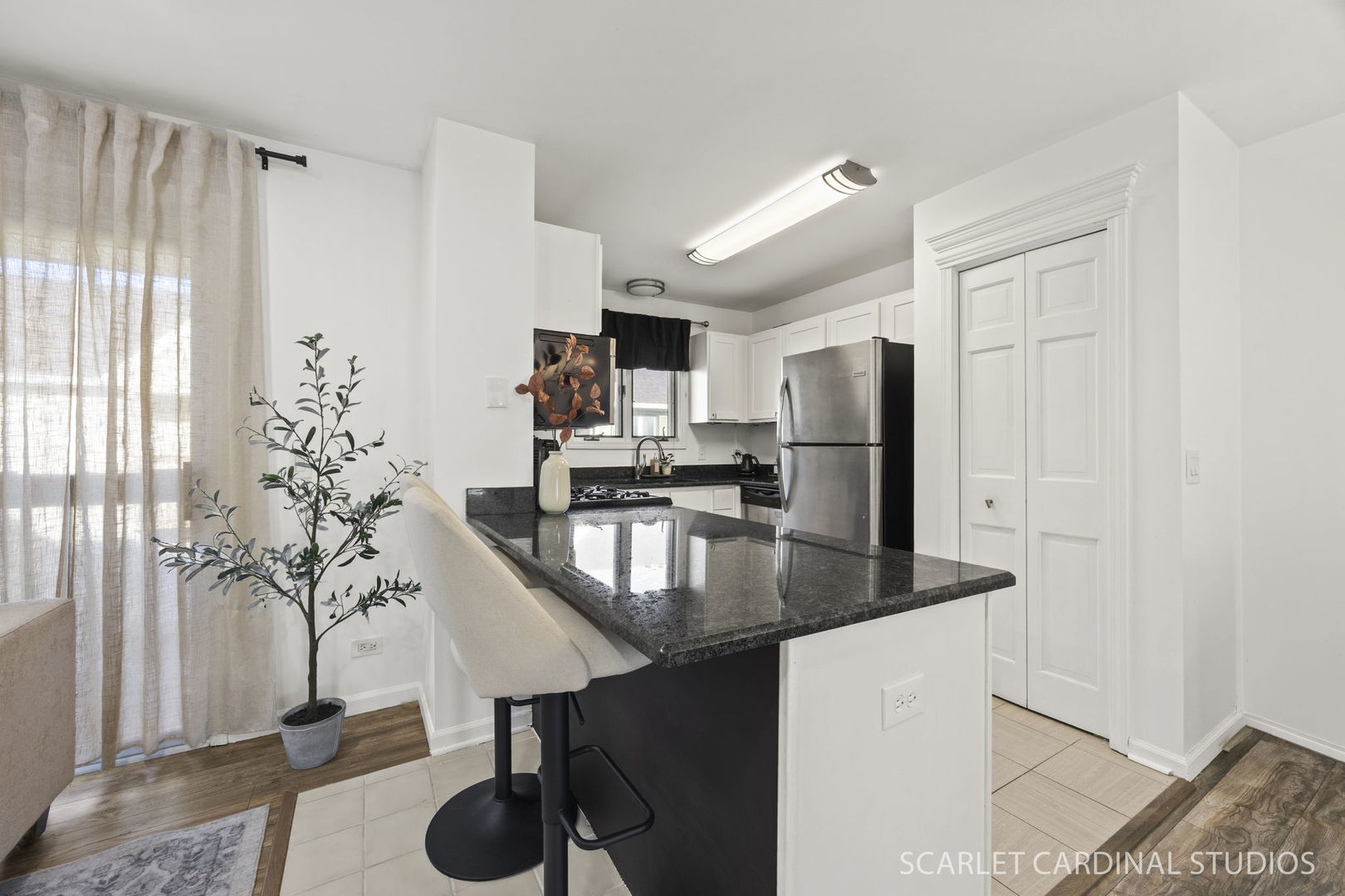 528 Pershing Avenue, Unit G Glen Ellyn, IL 60137 - Photo 4 of 14 a kitchen with stainless steel appliances a sink a refrigerator and microwave