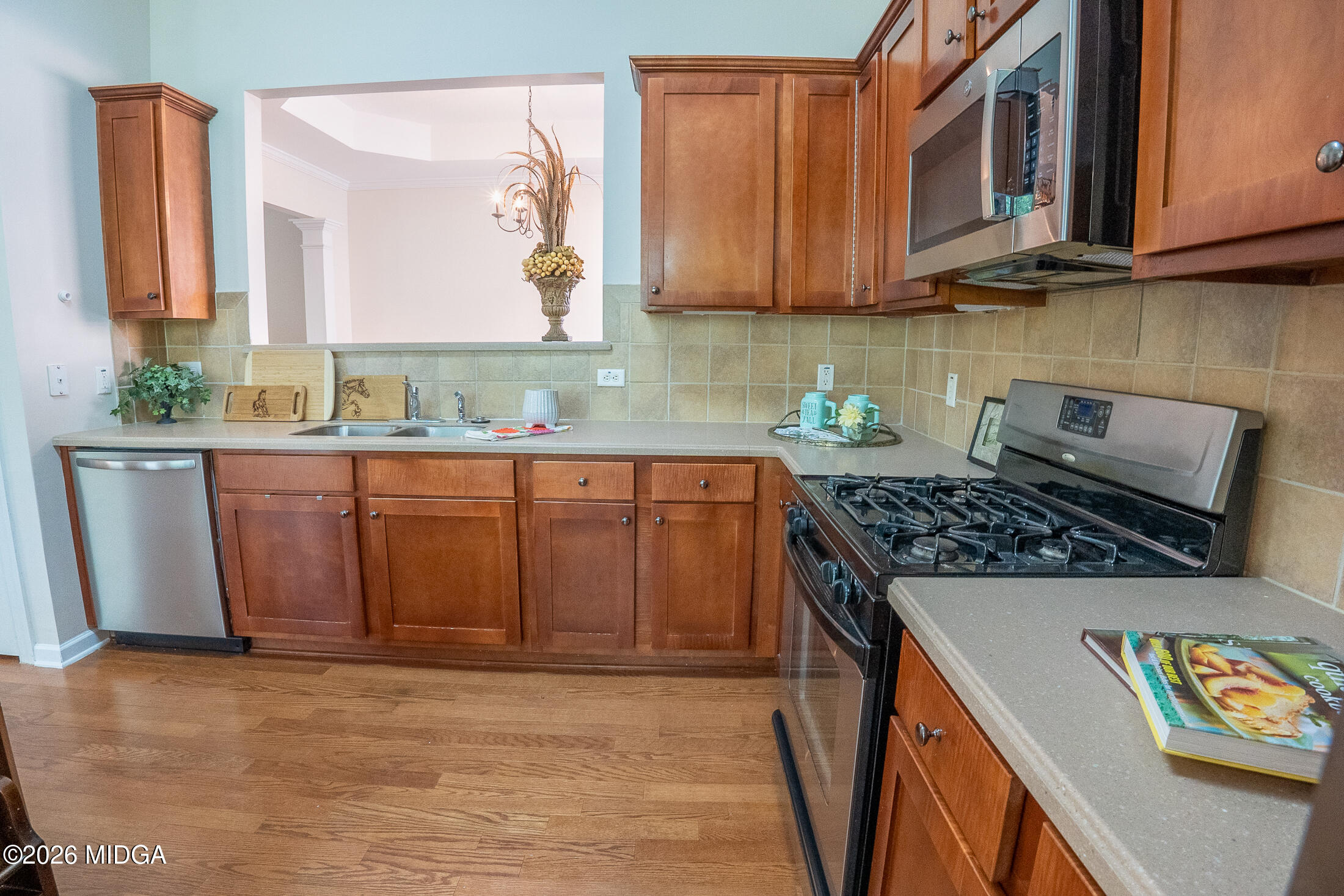 339 Fairways Drive Macon, GA 31220 - Photo 13 of 37 a kitchen with stainless steel appliances granite countertop a stove a sink and a microwave
