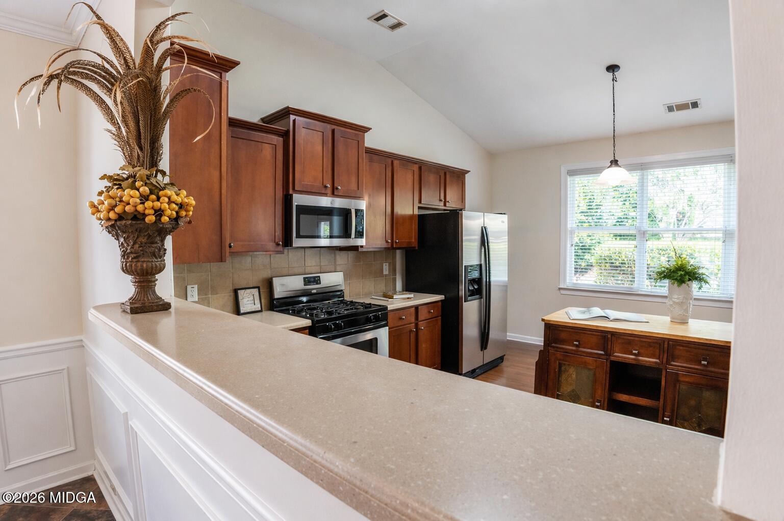 339 Fairways Drive Macon, GA 31220 - Photo 15 of 37 a kitchen with granite countertop a sink stainless steel appliances and cabinets