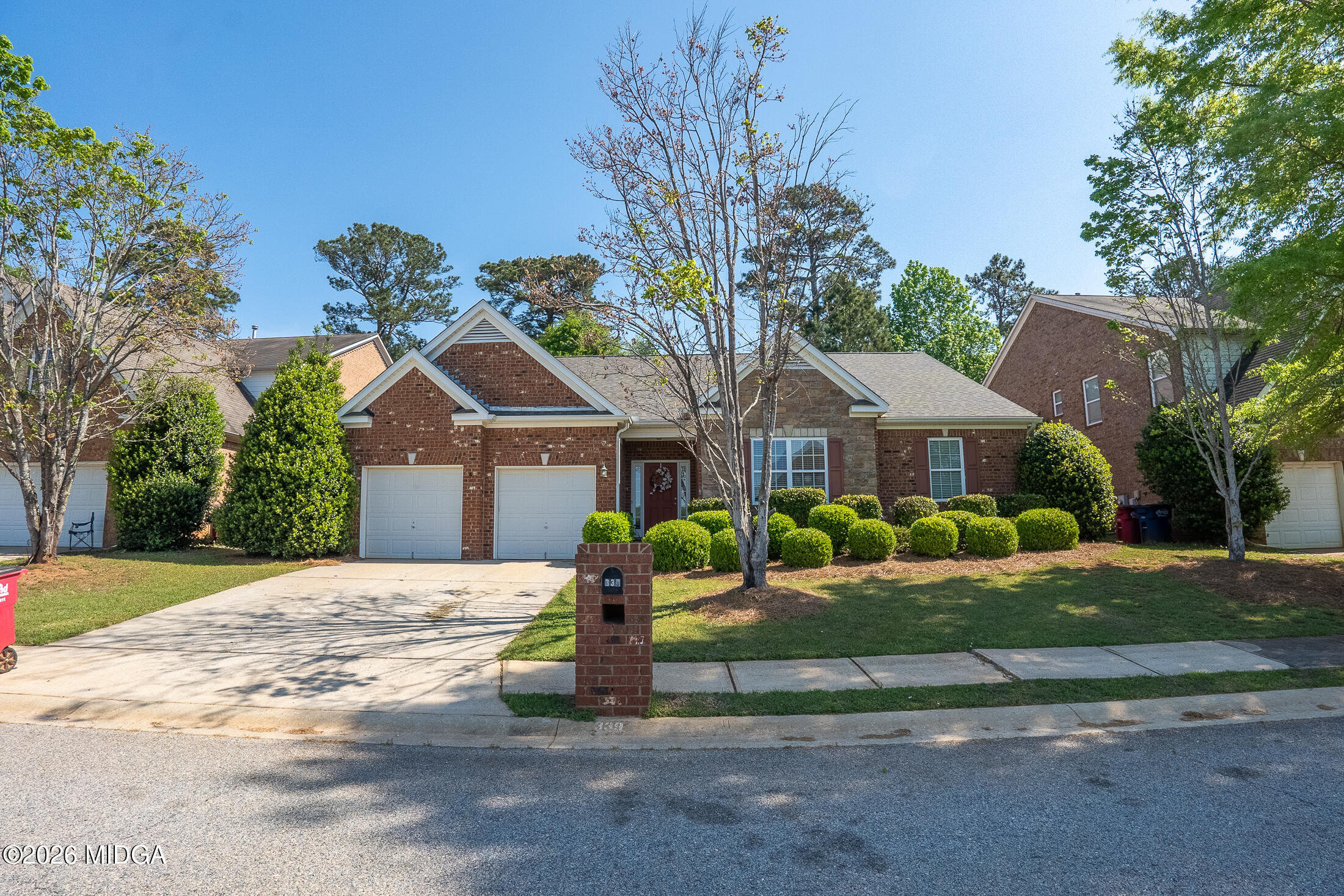 339 Fairways Drive Macon, GA 31220 - Photo 3 of 37 a front view of a house with a yard and garage