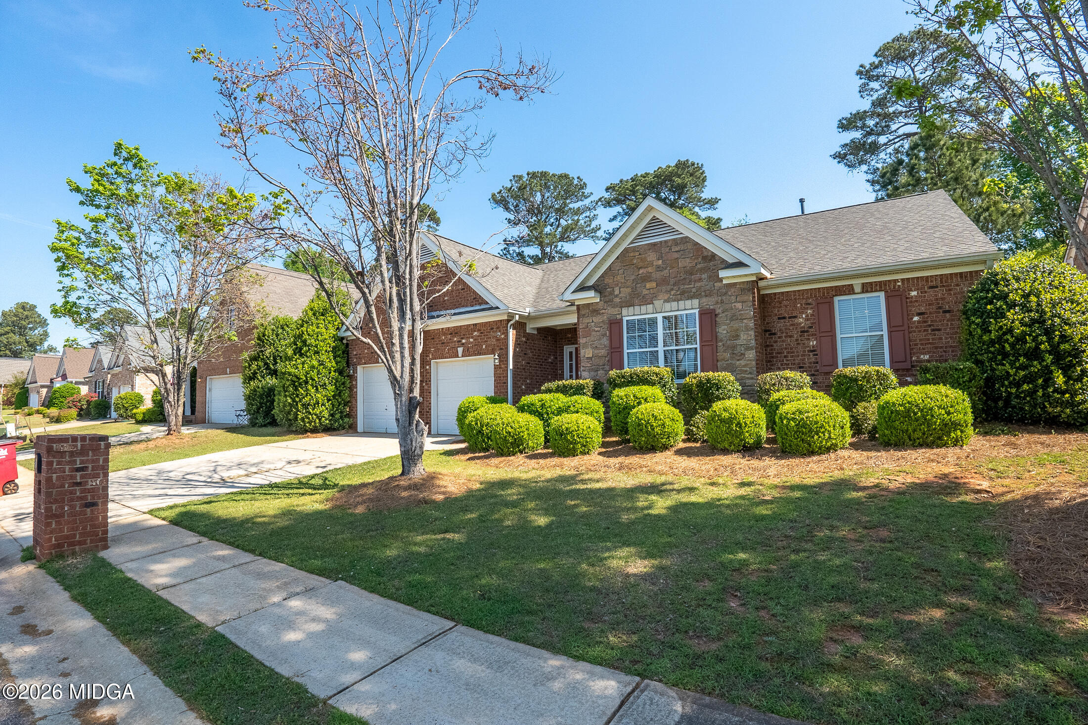 339 Fairways Drive Macon, GA 31220 - Photo 36 of 37 a large house with a big yard and large trees