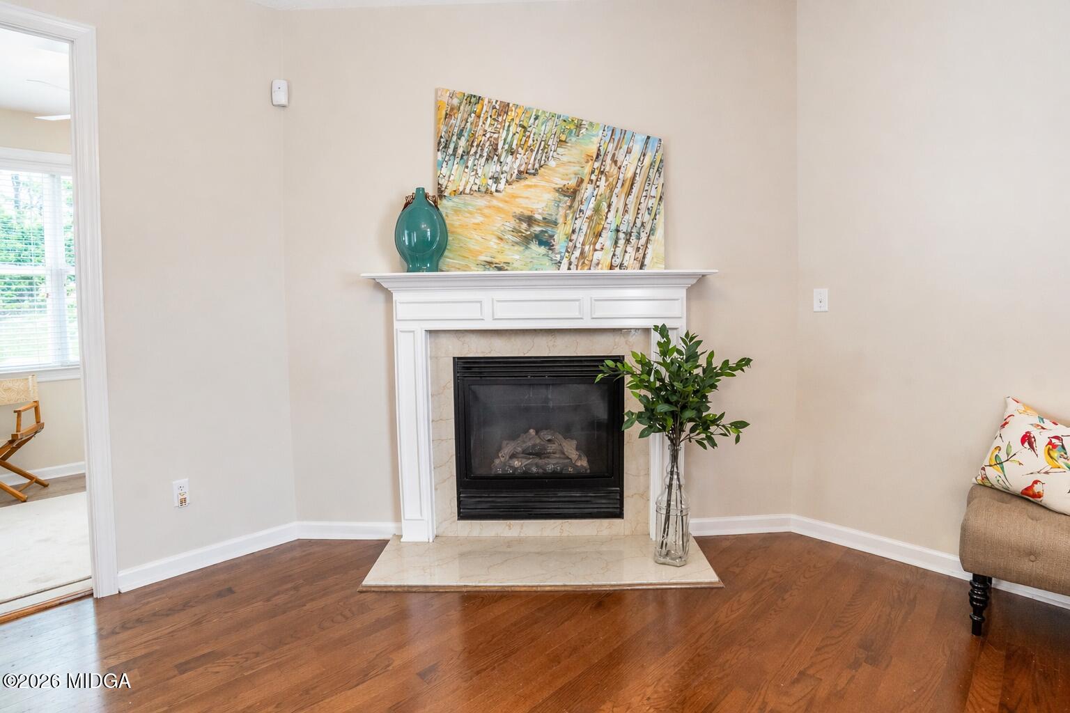 339 Fairways Drive Macon, GA 31220 - Photo 9 of 37 a living room with a fireplace and a potted plant