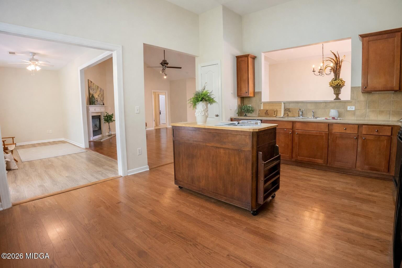 339 Fairways Drive Macon, GA 31220 - Photo 10 of 37 a large kitchen with stainless steel appliances granite countertop a lot of counter space and wooden floor