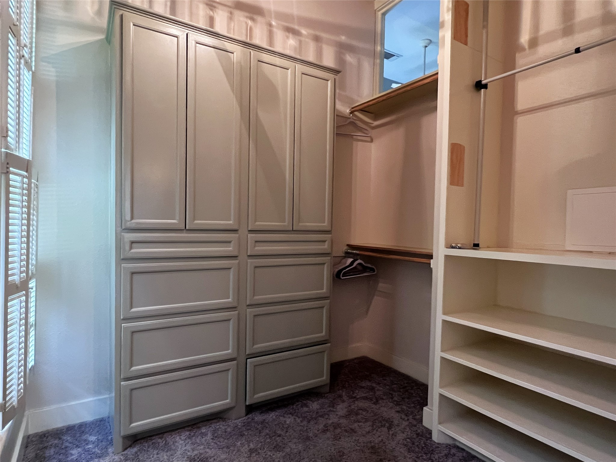 606 Sycamore Street Brenham, TX 77833 - Photo 12 of 27 a view of walk in closet with empty racks