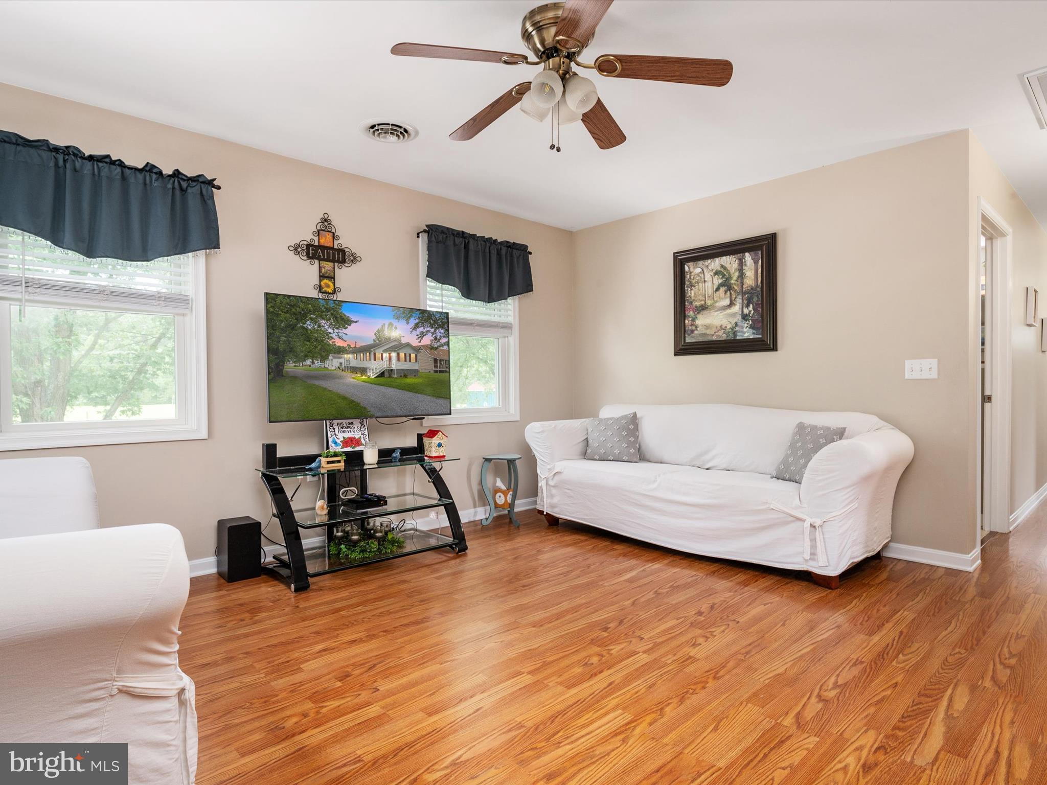 113 Radcliffe Road Grasonville, MD 21638 - Photo 13 of 30 a living room with furniture and a wooden floor
