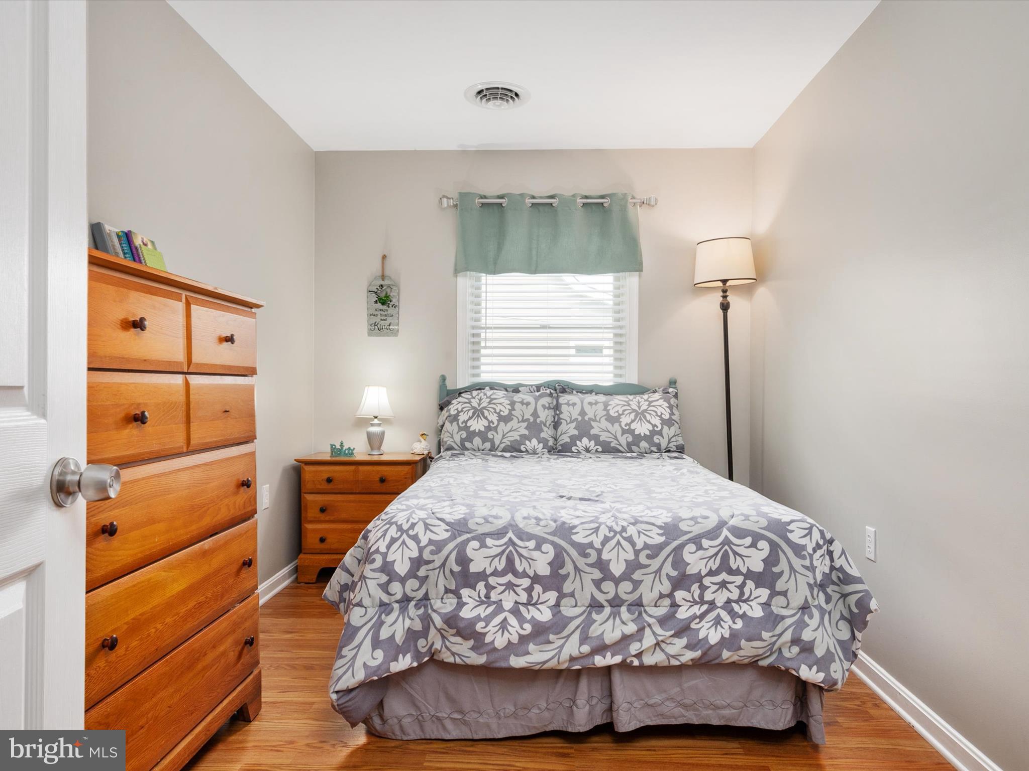 113 Radcliffe Road Grasonville, MD 21638 - Photo 17 of 30 a bedroom with a bed and a dresser