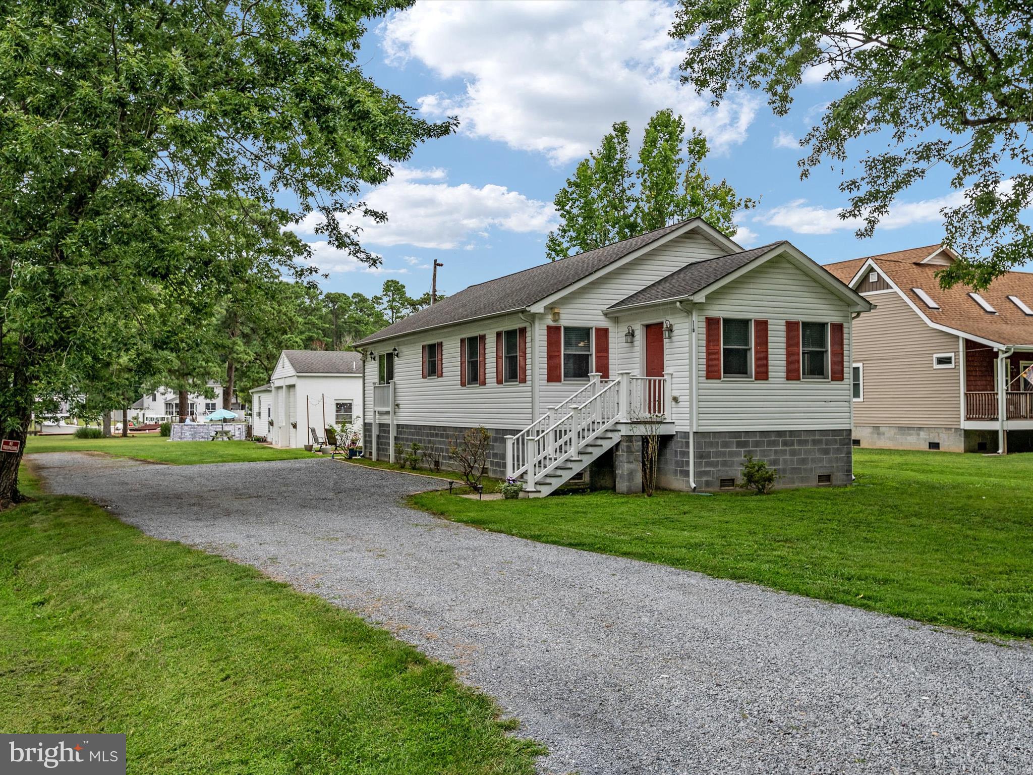 113 Radcliffe Road Grasonville, MD 21638 - Photo 27 of 30 a front view of a house with a garden