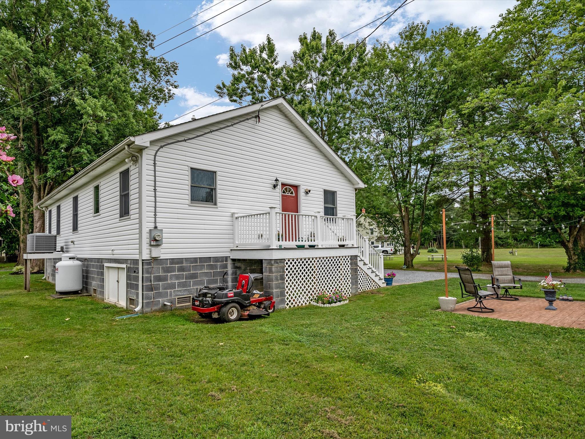 113 Radcliffe Road Grasonville, MD 21638 - Photo 28 of 30 a view of a house with a backyard and a tree