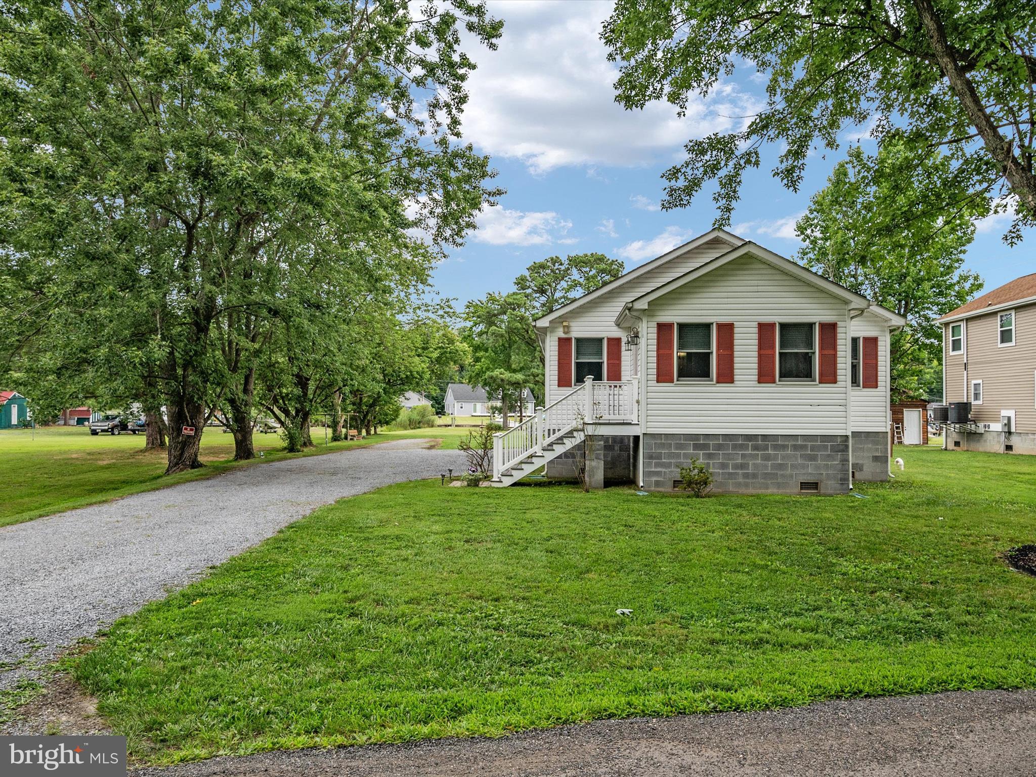 113 Radcliffe Road Grasonville, MD 21638 - Photo 29 of 30 a front view of a house with a garden