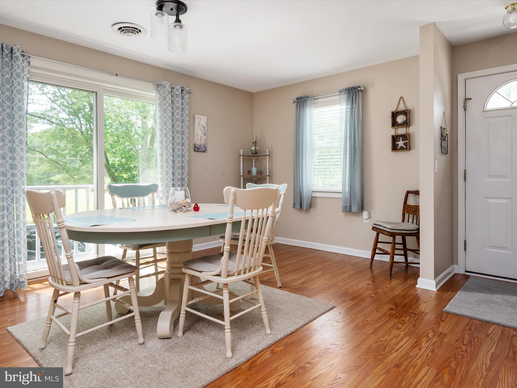 113 Radcliffe Road Grasonville, MD 21638 - Photo 6 of 30 a view of a dining room with furniture window and wooden floor