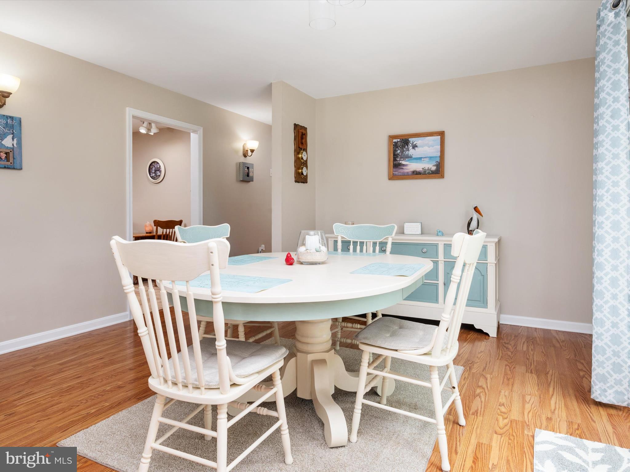 113 Radcliffe Road Grasonville, MD 21638 - Photo 8 of 30 a view of a dining room with furniture and wooden floor
