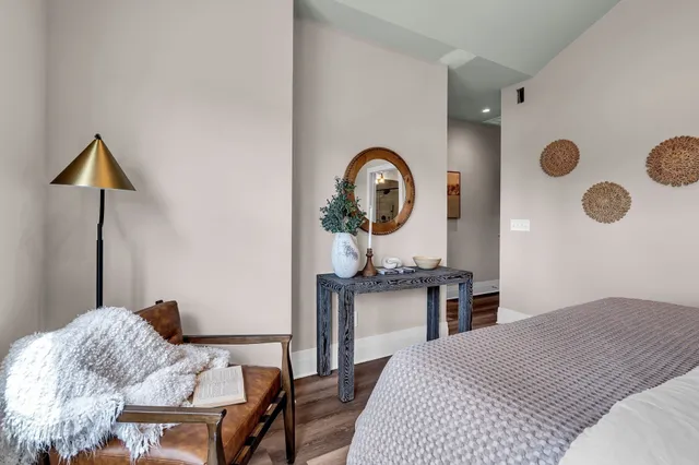 a bedroom with a bed and dresser