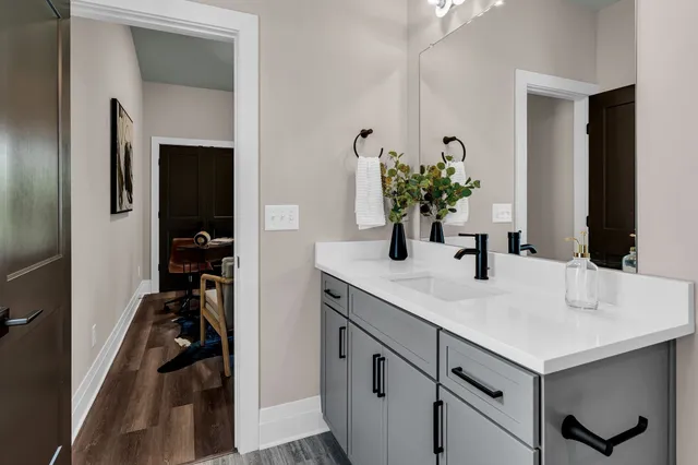 a bathroom with a sink and a mirror