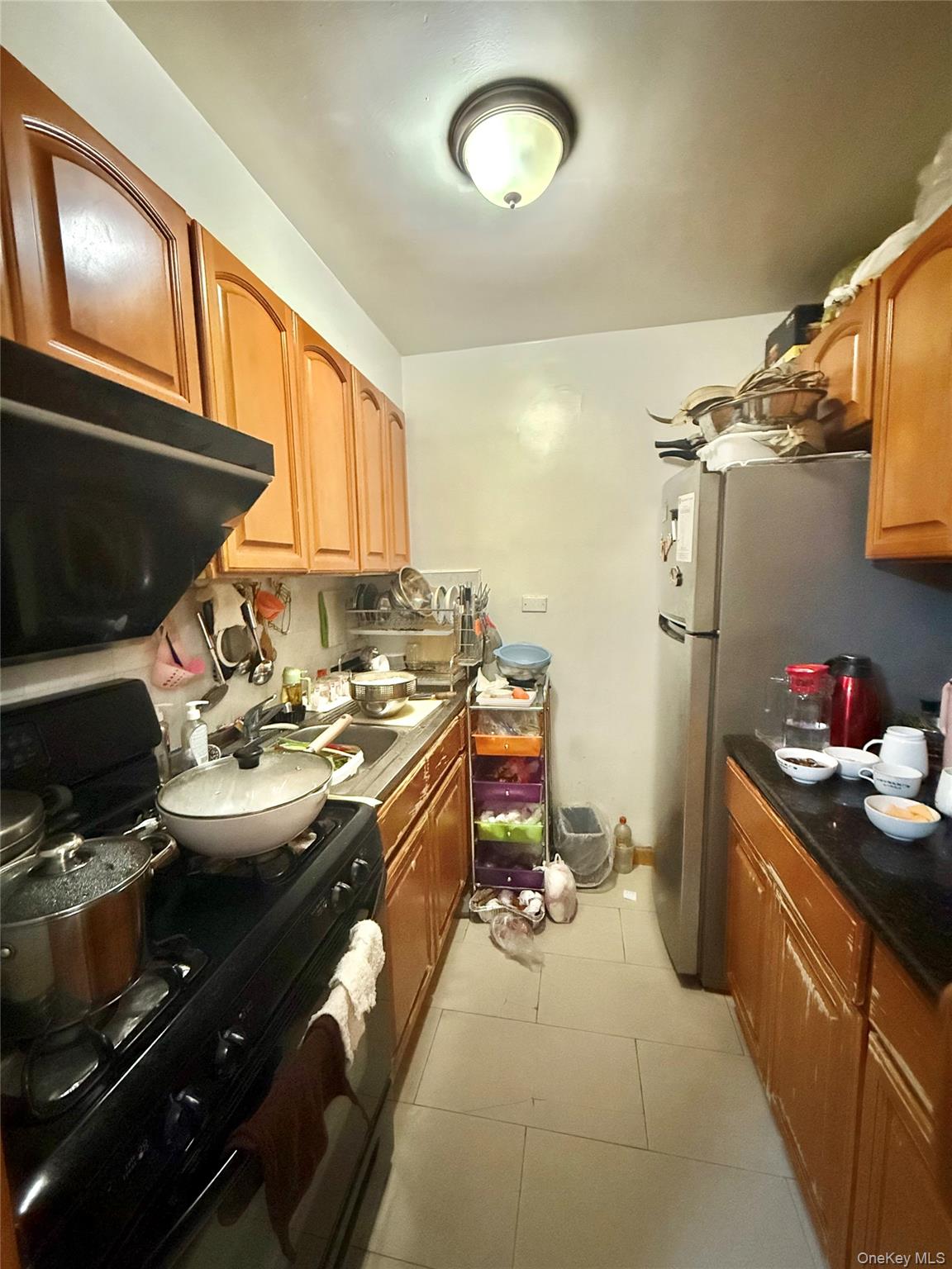 138-70 Elder Avenue, Unit 3A Queens, NY 11355 - Photo 2 of 10 a kitchen that has a sink and a stove
