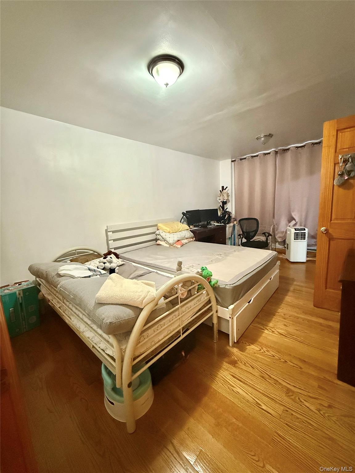 138-70 Elder Avenue, Unit 3A Queens, NY 11355 - Photo 3 of 10 a spacious bathroom with a double vanity and a mirror