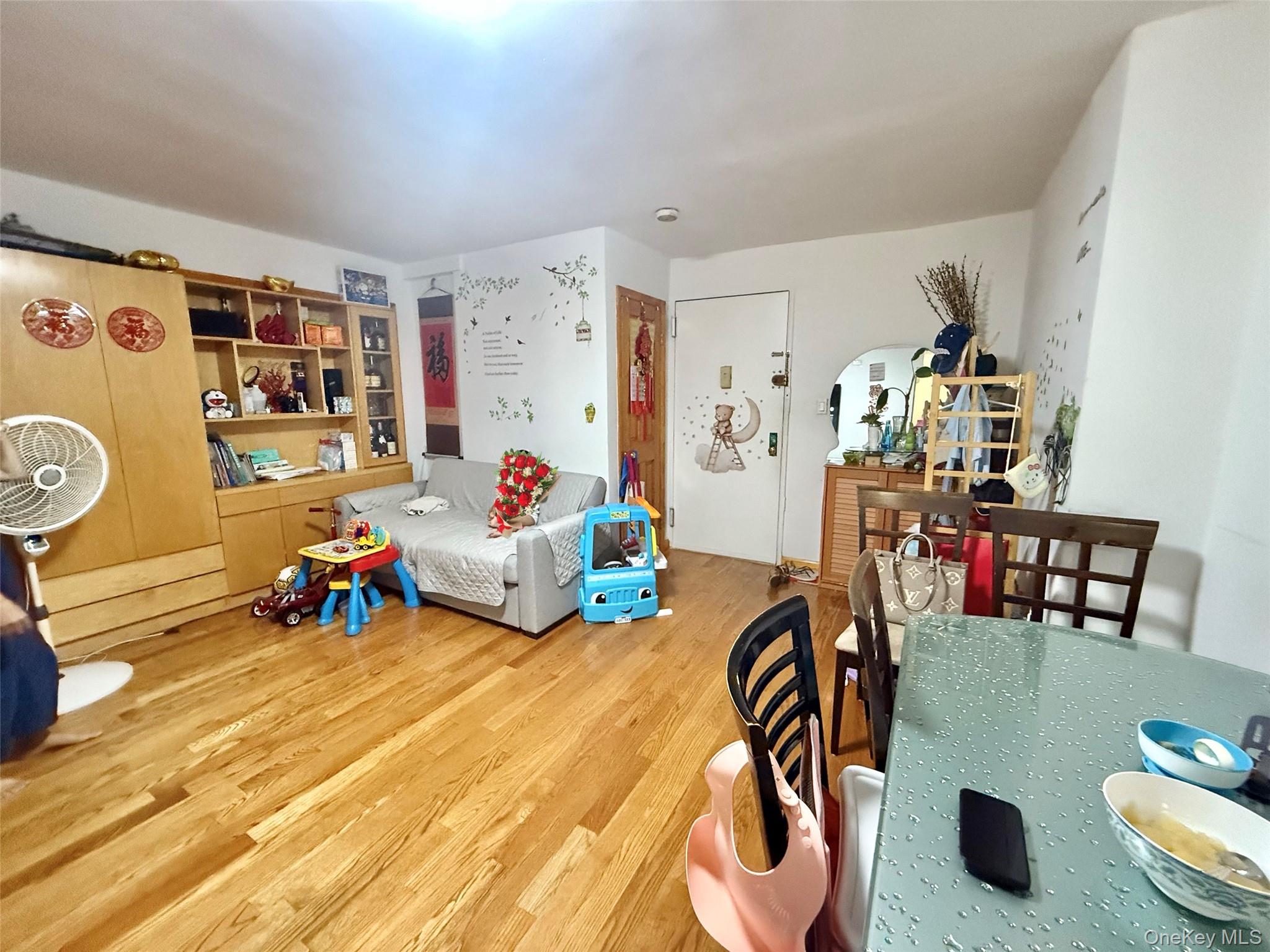 138-70 Elder Avenue, Unit 3A Queens, NY 11355 - Photo 9 of 10 a view of a dining room with furniture and a chandelier