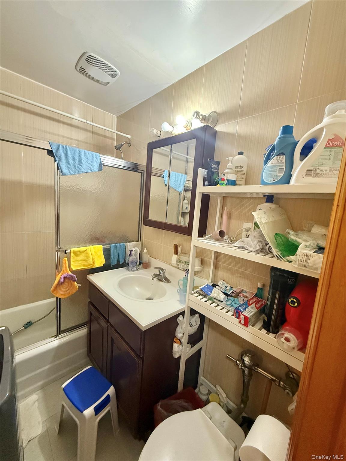 138-70 Elder Avenue, Unit 3A Queens, NY 11355 - Photo 10 of 10 a bathroom with a sink mirror and toilet