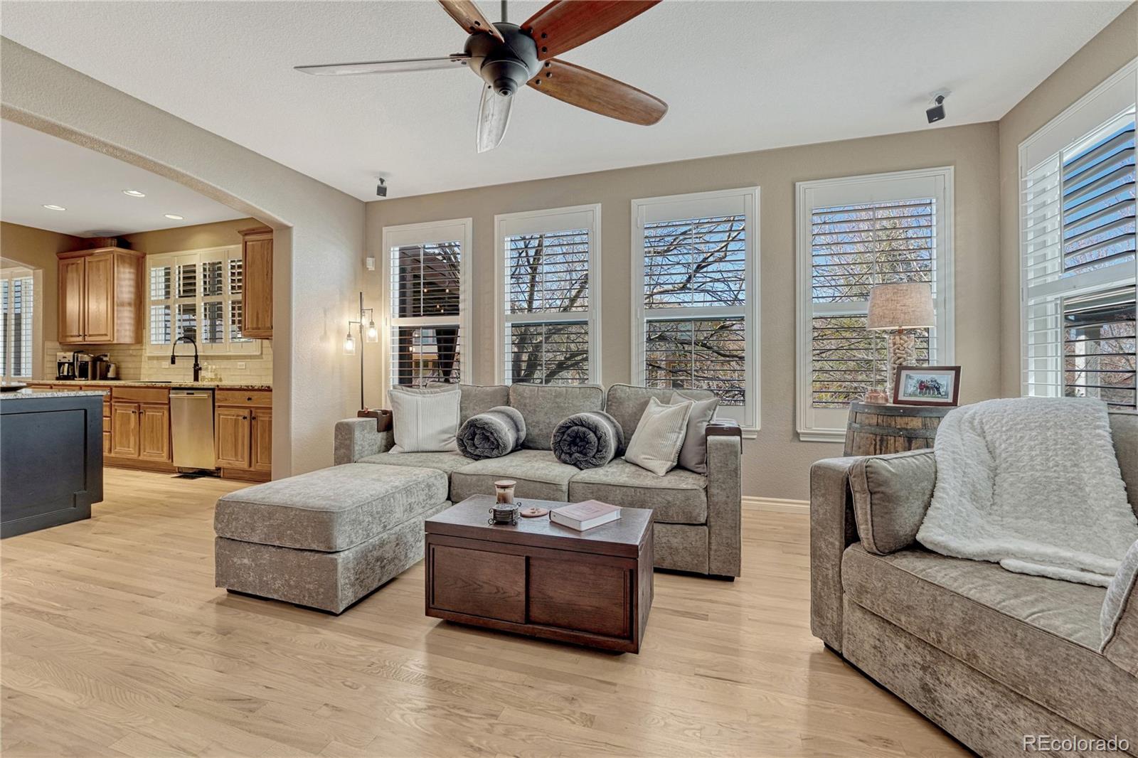 10761 Glengate Circle Highlands Ranch, CO 80130 - Photo 14 of 39 a living room with furniture and large windows