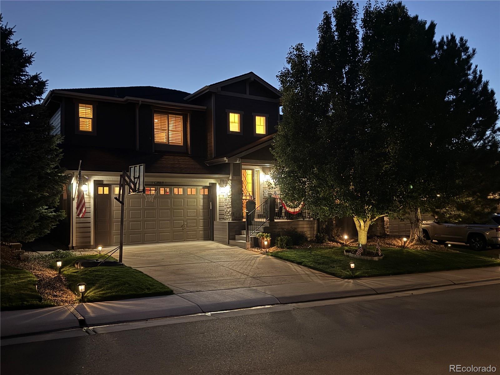 10761 Glengate Circle Highlands Ranch, CO 80130 - Photo 35 of 39 a view of a building with a street light and sign board