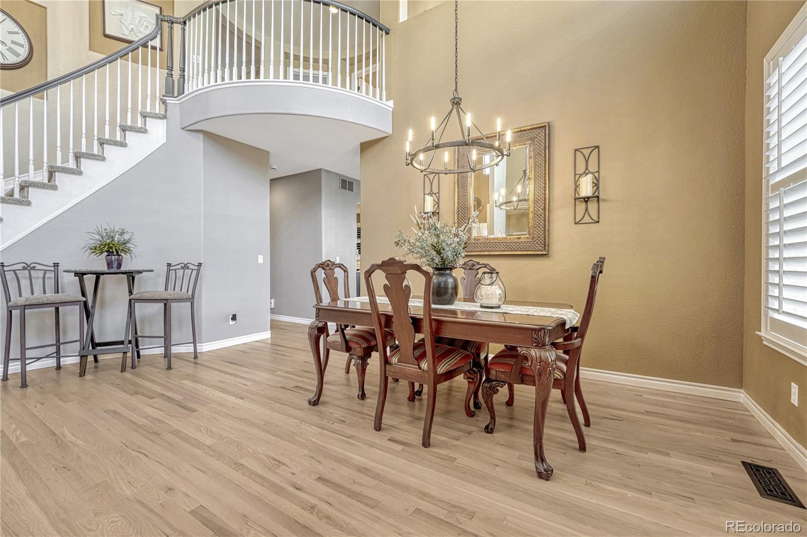 10761 Glengate Circle Highlands Ranch, CO 80130 - Photo 10 of 39 a view of a dining room with furniture window and wooden floor