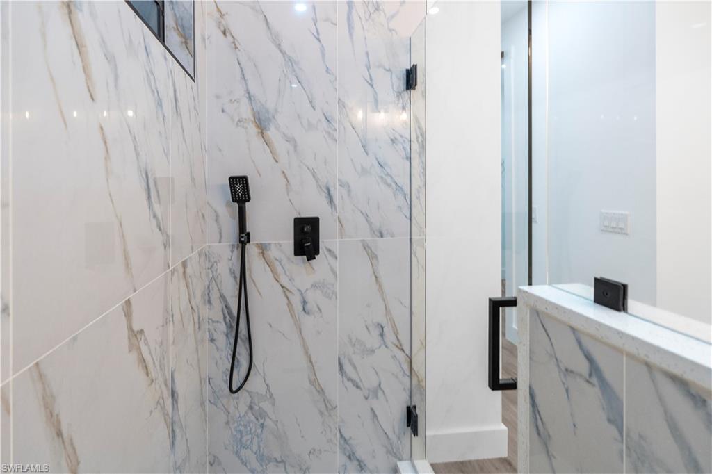 2714 24th Street West Lehigh Acres, FL 33971 - Photo 24 of 48 a bathroom with a shower and a sink