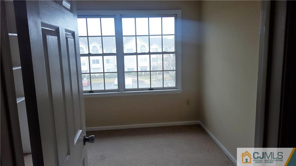 937 Edpas Road, Unit 937 New Brunswick, NJ 08901 - Photo 8 of 10 a view of room with window