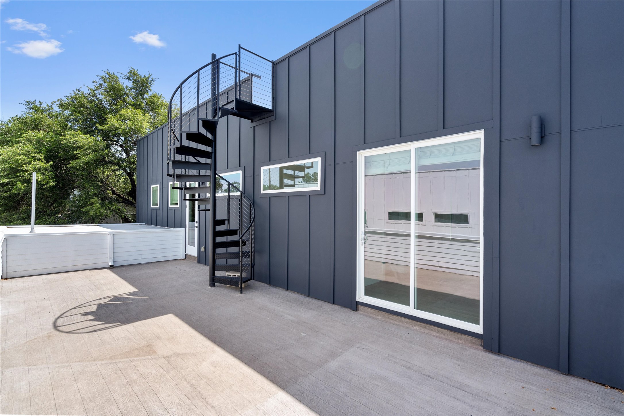 4712 Reyes Street, Unit 1 Austin, TX 78721 - Photo 28 of 38 a view of a porch with wooden floor and fence