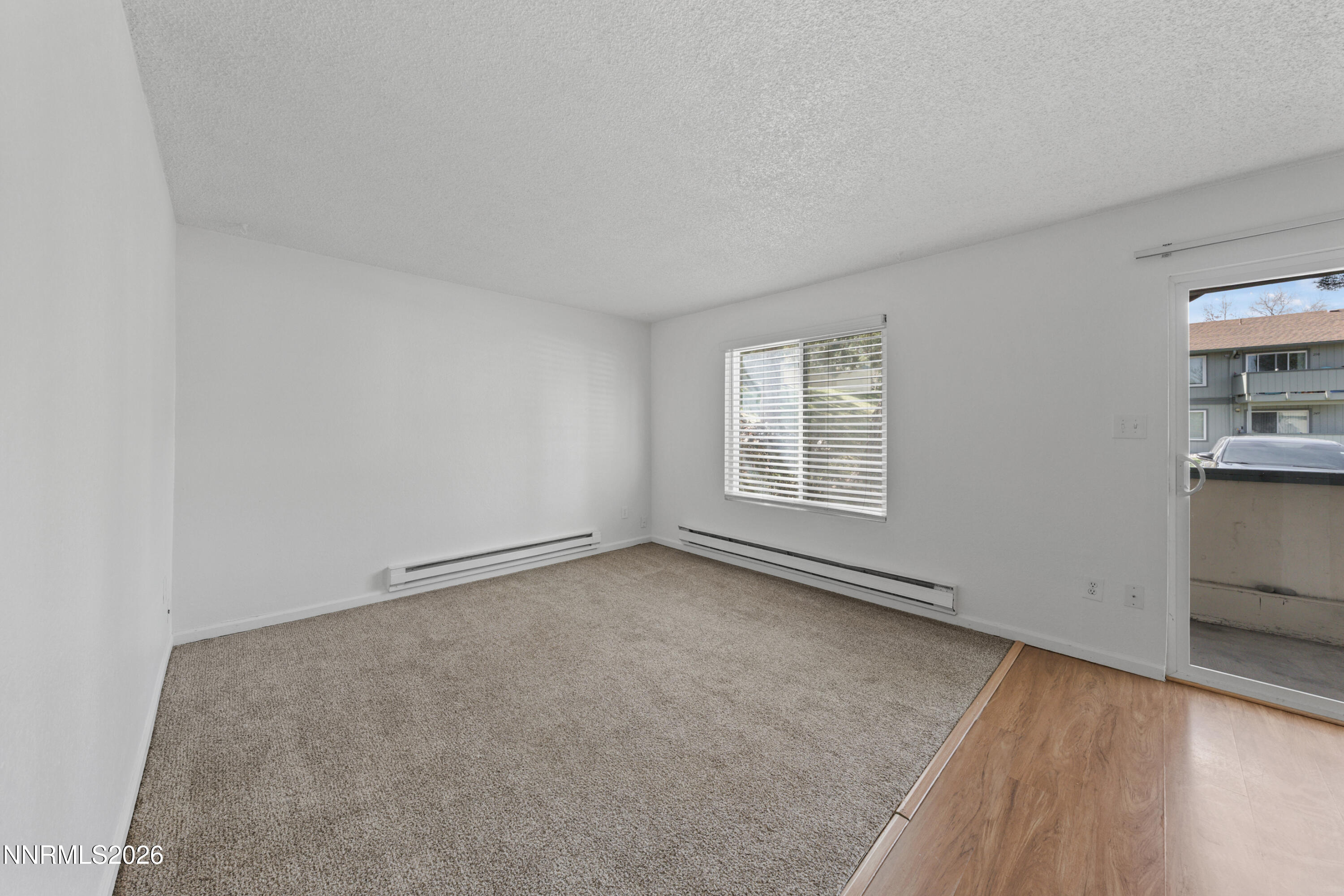 3942 Clear Acre Lane, Unit 241 Reno, NV 89512 - Photo 11 of 23 an empty room with windows