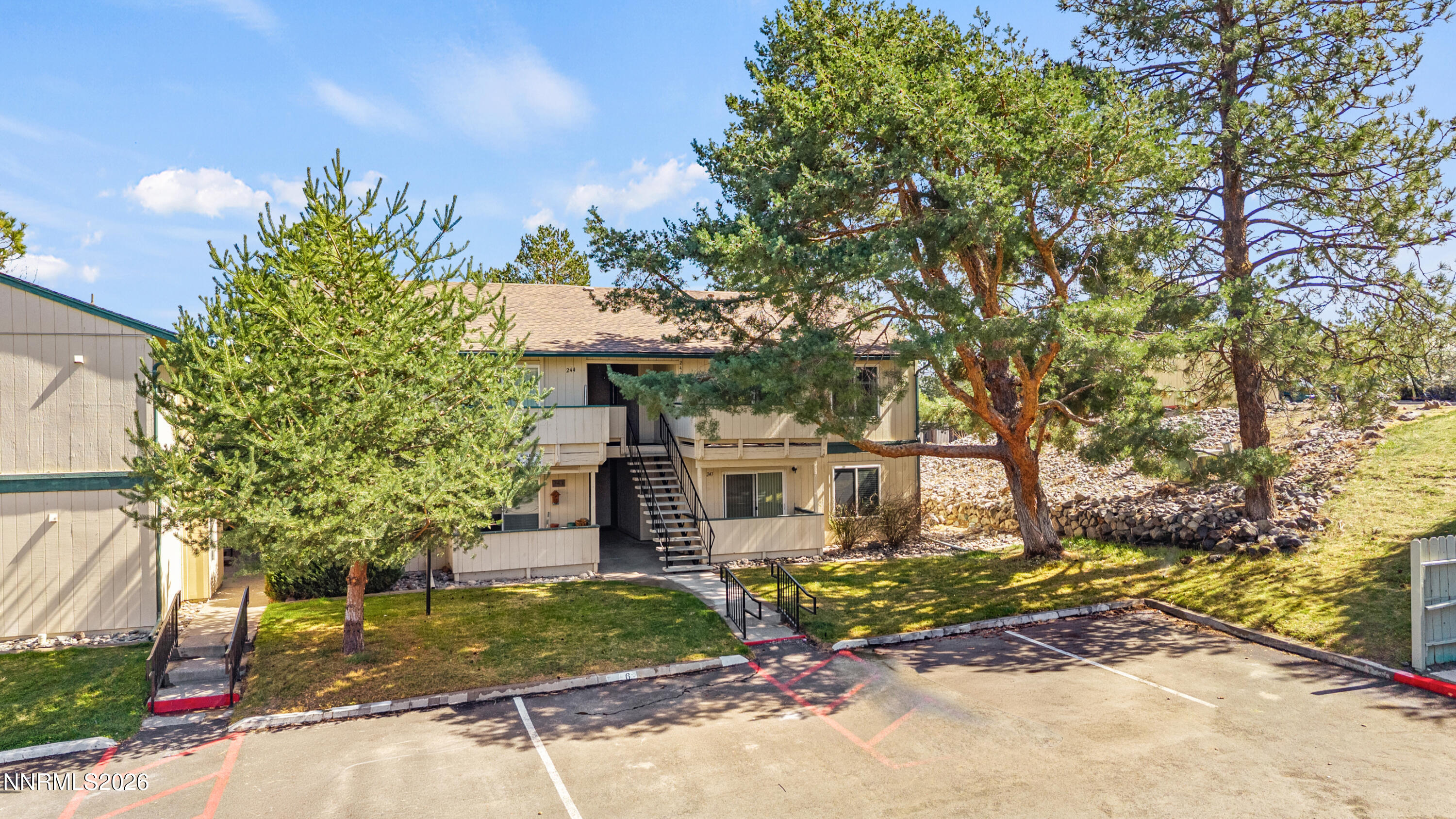 3942 Clear Acre Lane, Unit 241 Reno, NV 89512 - Photo 20 of 23 a front view of a house with a yard