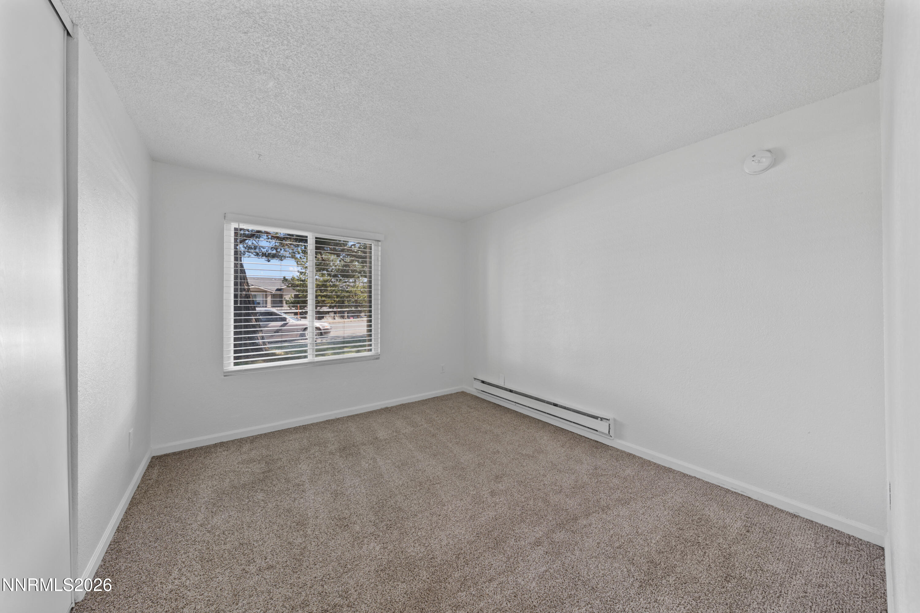 3942 Clear Acre Lane, Unit 241 Reno, NV 89512 - Photo 2 of 23 an empty room with a window