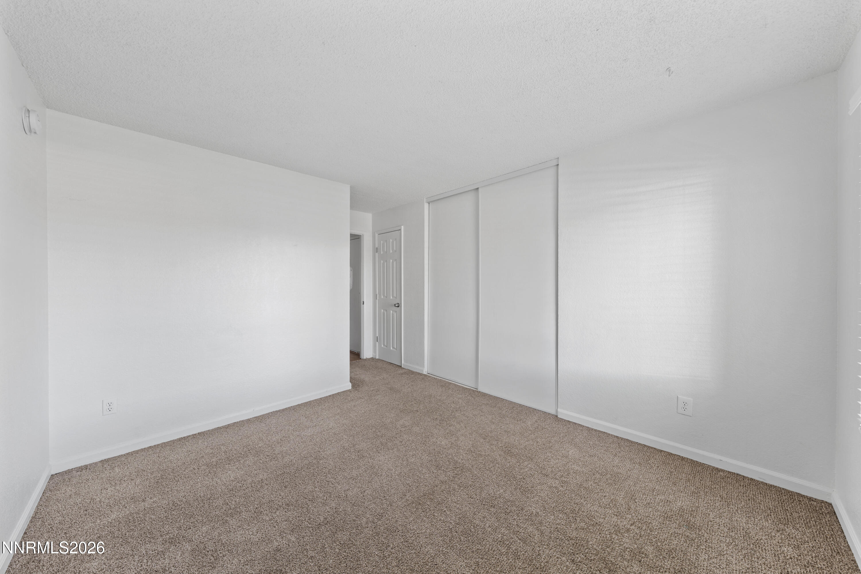 3942 Clear Acre Lane, Unit 241 Reno, NV 89512 - Photo 3 of 23 a view of an empty room and entryway