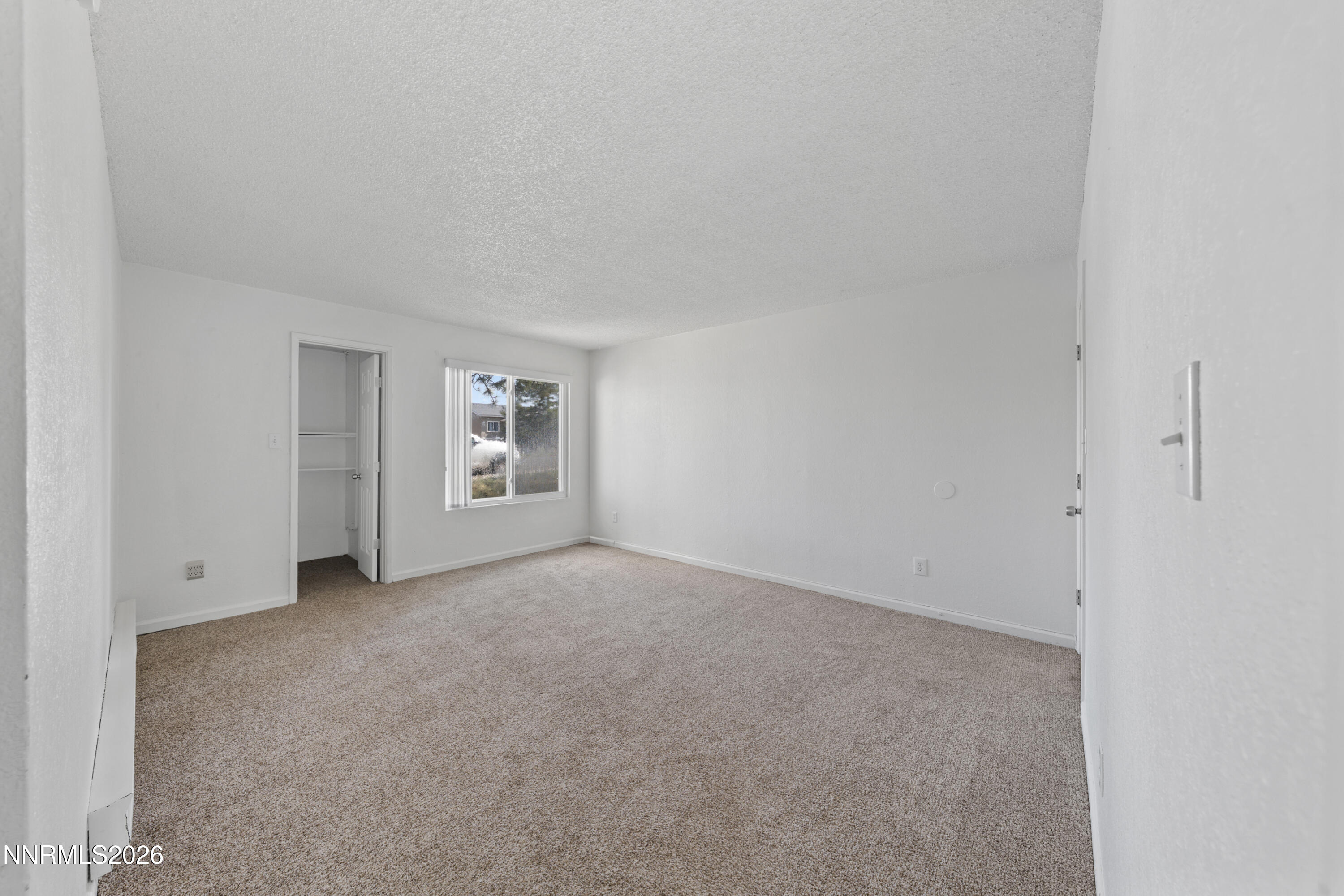 3942 Clear Acre Lane, Unit 241 Reno, NV 89512 - Photo 5 of 23 a view of an empty room with a window