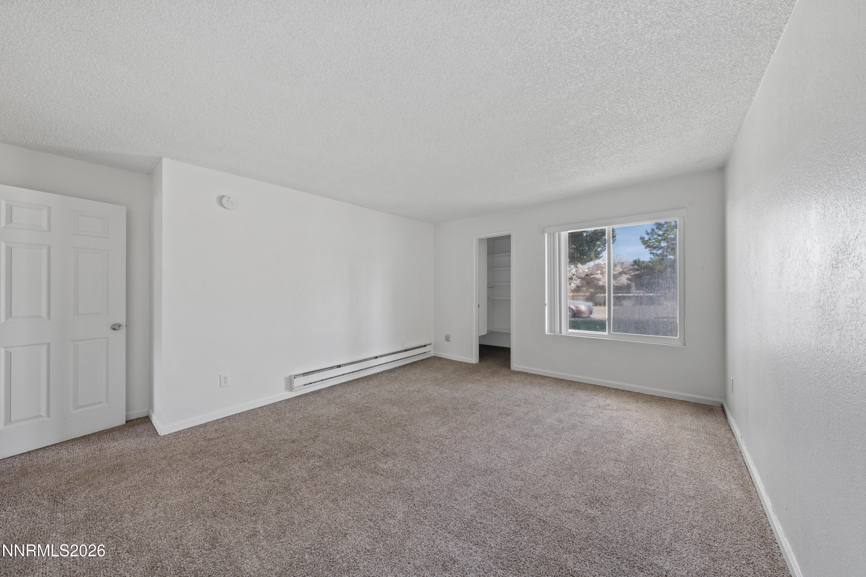 3942 Clear Acre Lane, Unit 241 Reno, NV 89512 - Photo 6 of 23 a view of an empty room with a window