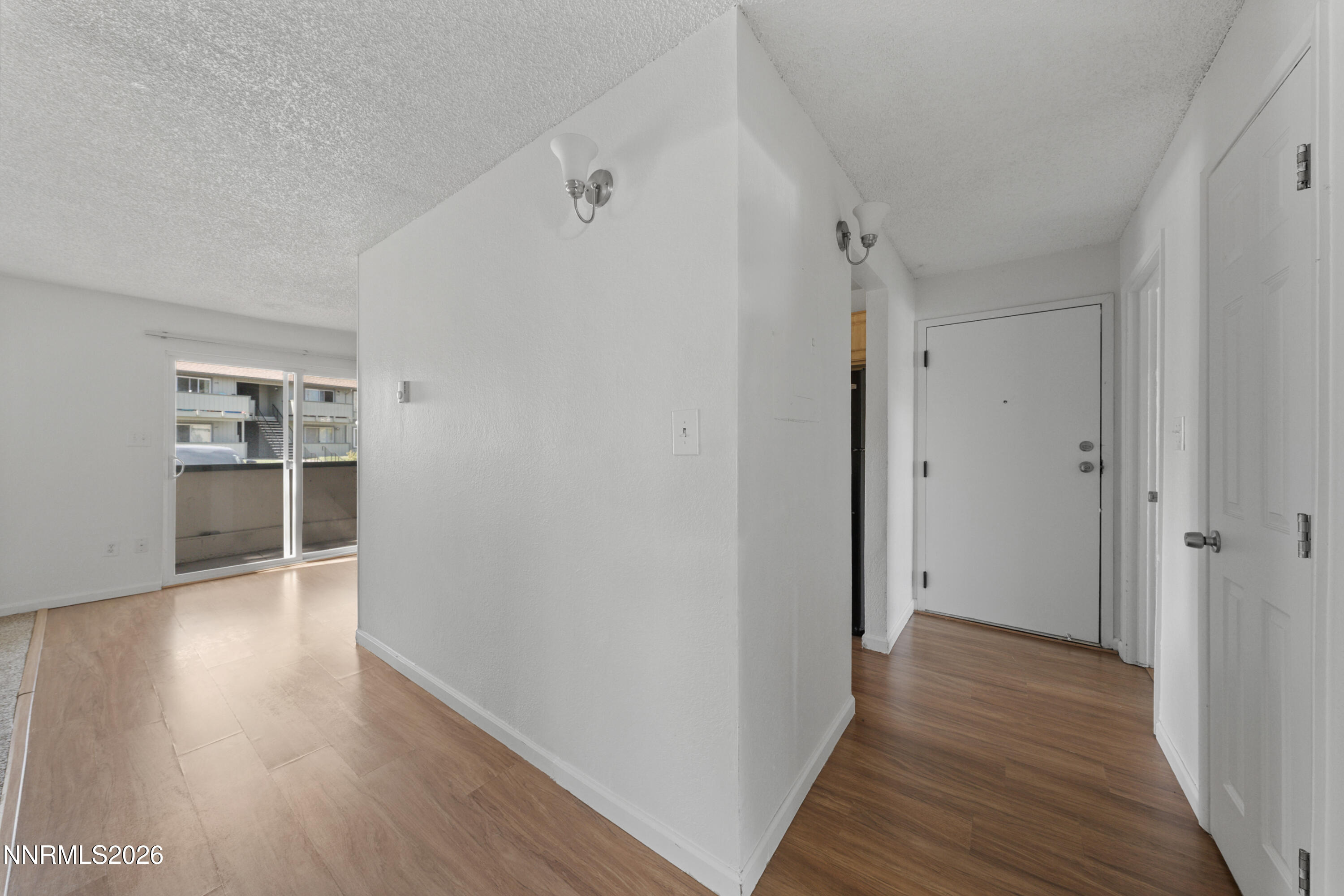 3942 Clear Acre Lane, Unit 241 Reno, NV 89512 - Photo 10 of 23 a view of a hallway with wooden floor