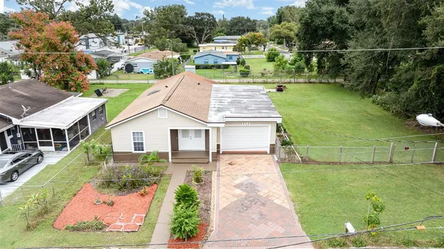 an aerial view of a house with a garden