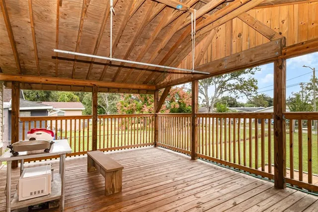 a view of a balcony with wooden floor