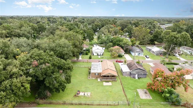 an aerial view of residential houses with city view