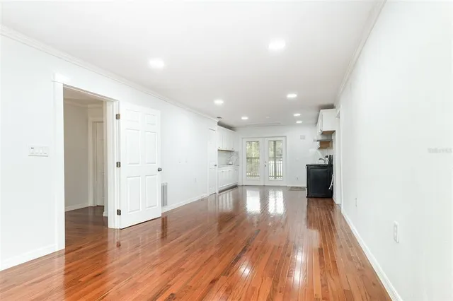 a view of a kitchen with wooden floor