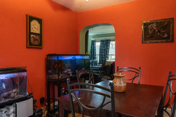 a room with furniture and musical instruments
