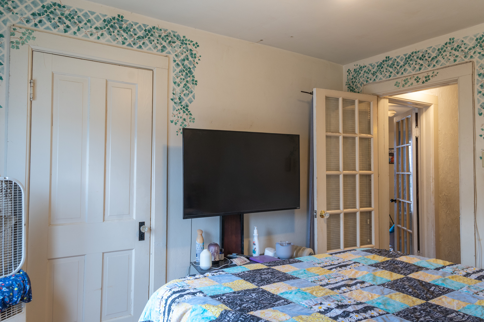 223 West Avon Street Freeport, IL 61032 - Photo 8 of 14 a bedroom with a bed and a flat screen tv