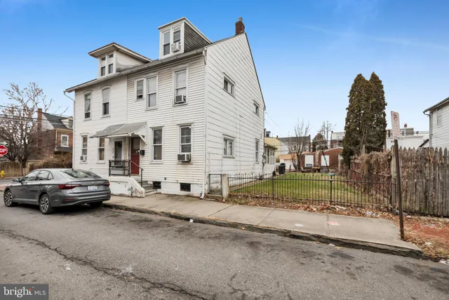 a view of multiple houses with a street