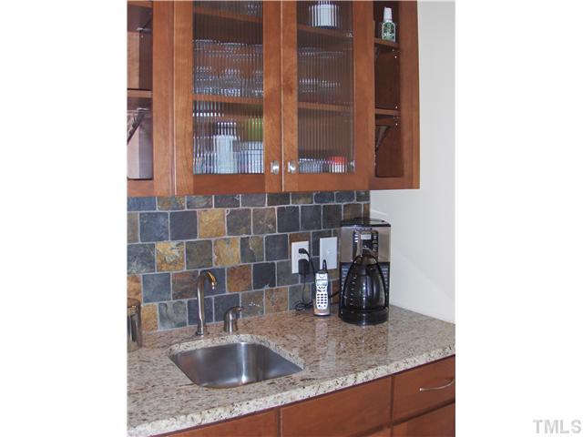 1716 Struble Circle Willow Spring, NC 27592 - Photo 12 of 25 a bathroom with a sink and a mirror