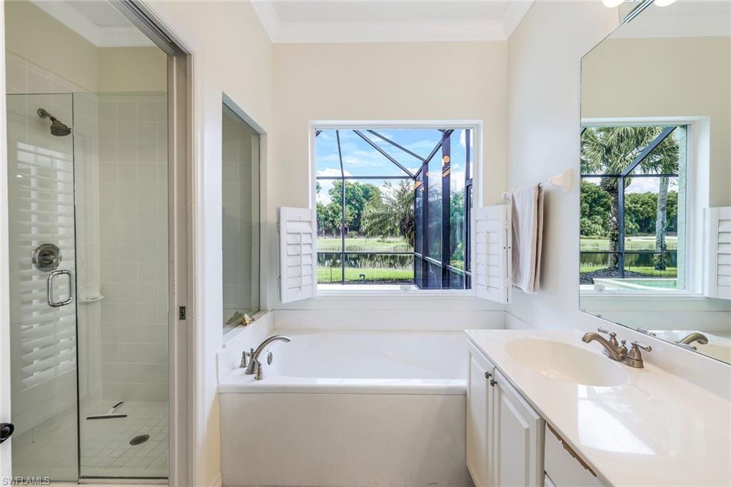 17983 Modena Road Miromar Lakes, FL 33913 - Photo 16 of 44 Master Bathroom with dual sinks, soaker tub and a wealth of natural light