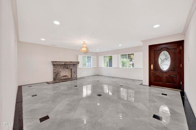 a bathroom with a granite countertop toilet sink and shower