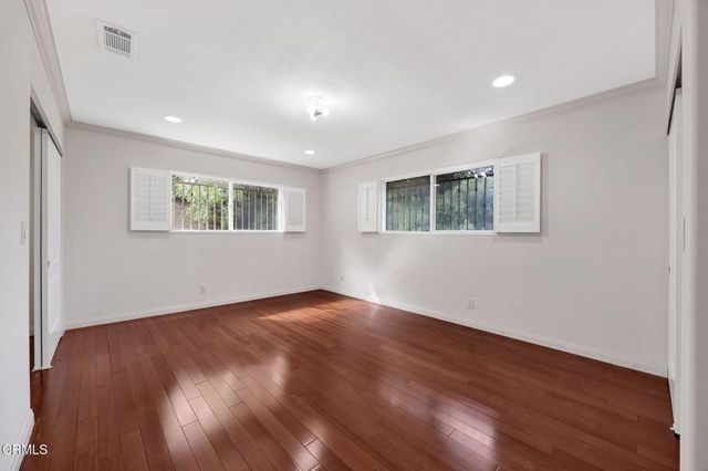 a bathroom with a granite countertop sink mirror toilet and bathtub