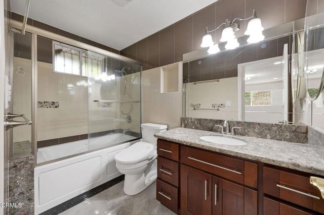 a view of a backyard of the house