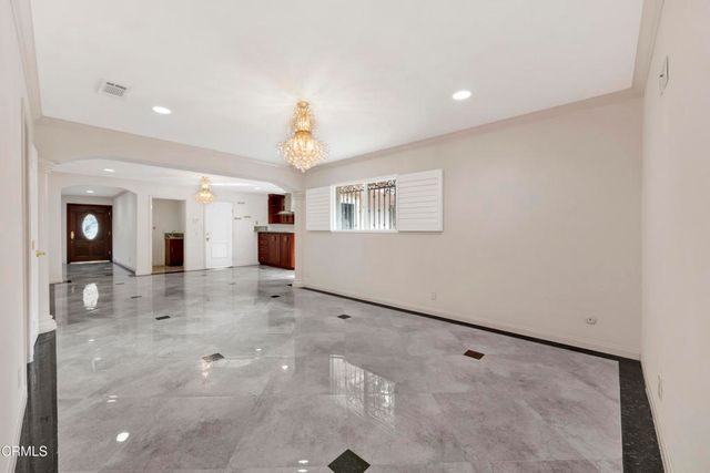 a view of a hallway with bathroom