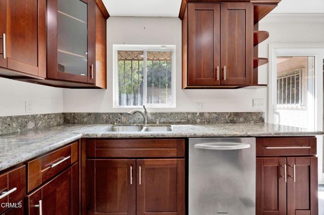 a kitchen with a sink and a window